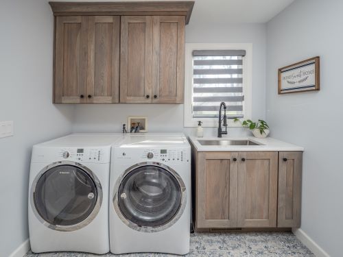 HIckory cabinets in a laundry room